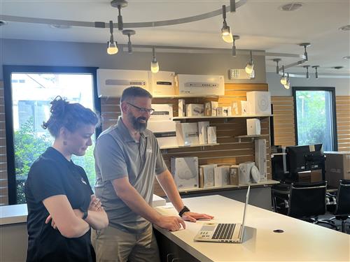  Amelia Brosnan looks at a computer at Extra Mile Technologies